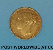 An 1882 young head gold full sovereign, type 2 reverse,