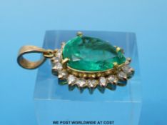 A gold pendant set with a pear cut emerald of approximately 7.