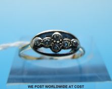 An 18ct gold ring set with six diamonds in a platinum setting (size K)