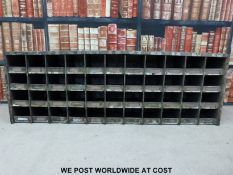 A vintage set of shopfitting / haberdashery / engineer's metal cubby holes with brass ticket