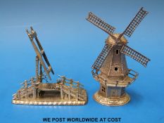 A continental white metal windmill, height 10cm together with a white metal drawbridge,