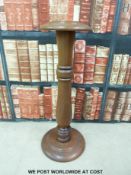 A turned mahogany jardiniere stand (Height 73cm)