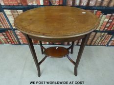An oval inlaid side table with under-shelf (H72, W46,