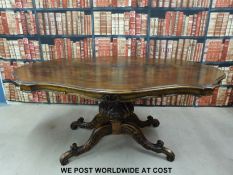 A continental French walnut table and eight carved dining chairs (height 77cm width 173cm depth