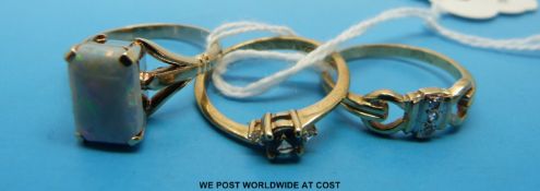 Three 9ct gold rings one set with an opal doublet