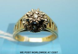 An 18ct gold ring set with nine diamonds in a cluster (size O)