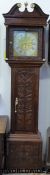 A mid 19thC eight day longcase clock in carved stained oak case, quarter column carved,