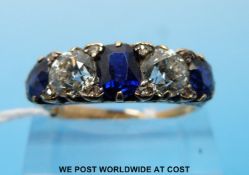 An 18ct gold ring set with two old cut diamonds each measuring approximately 0.