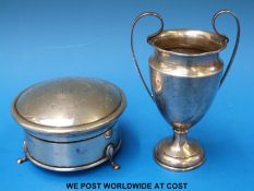 A hallmarked silver dressing table pot on three feet (11cm diameter) together with a hallmarked