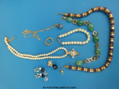 A collection of necklaces to include faux pearl,