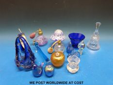 A collection of largely glass paperweight including Ditchfield etc and perfume bottles etc