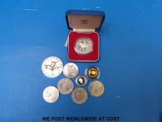 Four cased silver coins including 