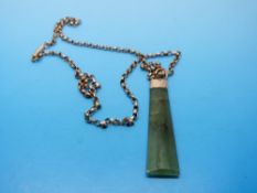 A 9ct gold chain with 9ct gold pendant set with a jadeite plaque