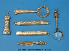 Three white metal needle cases (two marked sterling),