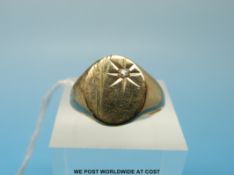 A 9ct gold ring set with a clear stone (size R, 4.