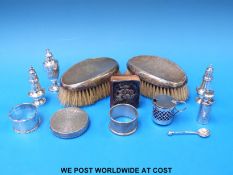 A hallmarked silver-mounted book, two hallmarked silver napkin rings,