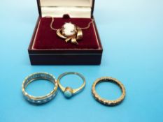 An 18ct gold ring set with clear stones, a yellow metal ring marked 9ct gold set with turquoise,