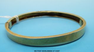 A yellow metal bangle believed to be 15ct (10.