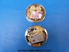 Two commemorative British banknotes coins each 50mm diameter, proof grade nos.