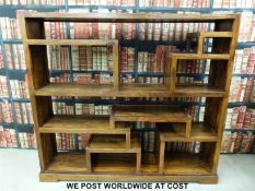 An oriental hardwood shelf unit or room divider (H151, W167,
