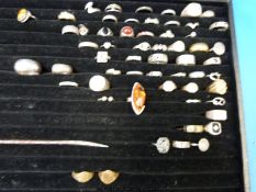 Over 30 white metal/ silver rings, variously set with marcasite, pressed amber,