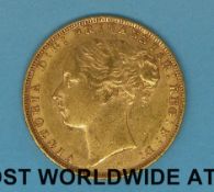 An 1876 young head gold full sovereign,