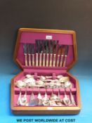 A cased six place canteen of cutlery with embossed silver plated handles by Smith Seymour,