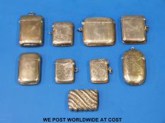 Four hallmarked silver vestas and five plated examples