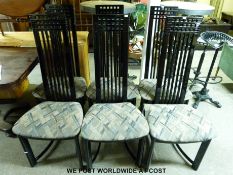 Six chairs by Kesteiport finished in black with covered seats,