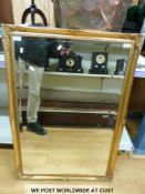 An ornate bevelled glass mirror