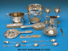 A hallmarked silver dressing table set, ornamental stands,