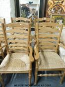 A set of seven (5+2) Arts & Crafts oak ladder back rush seated chairs