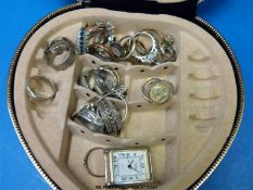 A collection of silver / white metal rings