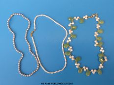 Two single strand pearl necklaces and an agate and pearl necklace
