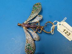 A large enamelled dragonfly brooch