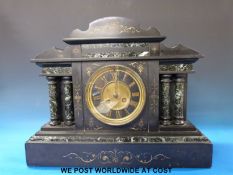 A black slate mantel clock with two train movement and Roman numerals