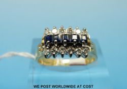 A 9ct gold ring set with a row of sapphires and two rows of cubic zirconia (Size N)