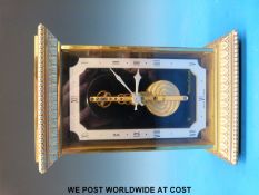 A Jaeger-LeCoultre mantel clock with visible movement (height 14.