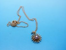 A 9ct gold pendant set with amethysts,