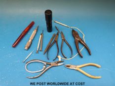 A quantity of watchmakers tools including Moore and Wright screwdriver set, pliers and a Cyma watch.