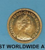 A 1982 cased uncirculated gold half sovereign