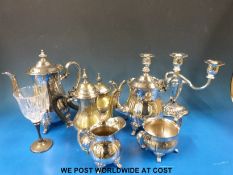 A collection of silver plated items to include a tea set, two trays,