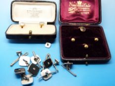 Three 18ct gold studs in original box,