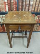 A late 19thC / 20thC mahogany table inlaid with white metal,