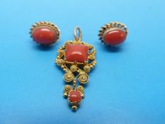 A yellow metal filigree pendant set with coral with similar 9ct gold earrings