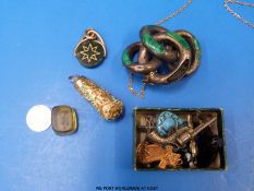 A silver and malachite brooch, a gilt and turquoise pendant,