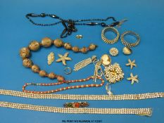 A small quantity of costume jewellery to include Miracle brooch,