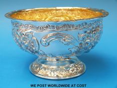 A Victorian hallmarked silver embossed bowl with gilt wash interior and embossed decoration,