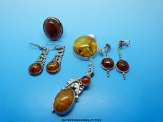 A quantity of amber and white metal jewellery