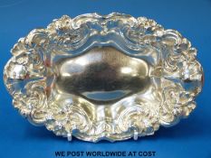 A white metal Art Nouveau style bowl with Tiffany style lily design,